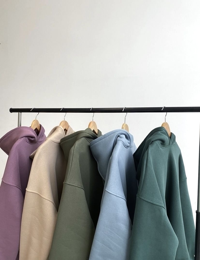 Row of branded hoodies for bulk custom apparel orders